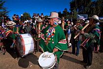 Quechua musicians and dancers at festival of camelids, La Paz, Bolivia