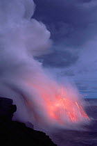 Volcanic lava flow enters the sea, Kilauea active volcano, Hawaii, USA. January 2000.