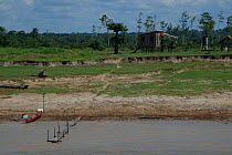 Stilt houses on shores of Amazonas River in the dry season. Brazil.