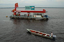 A floating gass station on the Amazon river, Brazil.