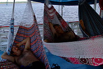 Steve Sargison + Ted Oakes (producer) relaxing in hammocks, Brazil.