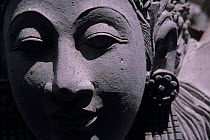 Stone sculpture of a dancer's head on a temple in Ubud. Bali, Indonesia.