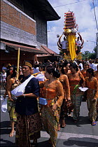 Local people in a procession for a Hindu funeral ceremony. Bali, Indonesia.