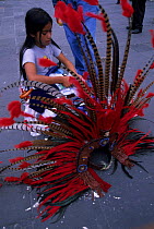 Preparing Aztec feather head-dresses for Independence Day in Mexico city