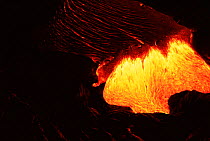 Hot pahoehoe lava flowing from Kilauea Volcano, Hawaii Volcanoes National Park, Hawaii.