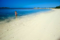 Girl on beach, Walker's Cay, Bahamas