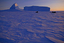 Inuit family return from collecting iceberg ice for fresh water. Baffin Island, Canada