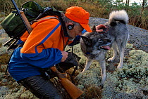 Moose hunter, Gunnar Johansson, with his gun dog, Varmland, Sweden.