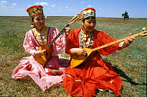 Kalmykian women dressed up for May Day holidays, Yashkul, Russia.