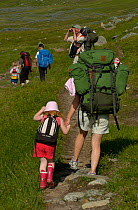 Family hiking in Vindelfjallen Nature Reserve, Lapland, Sweden.