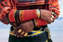 Local woman wearing mola arm decorations, San Blas Islands, Panama