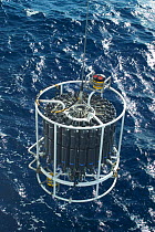 Launching CTD (conductivity, temperature, depth) water sampling equipment from research boat GO Sars. Atlantic ocean deep sea research