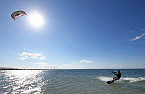 Kite surfing in sea off Playa de Gola, Santa pola, Alicante, Spain.