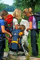 Children reading map while hiking, Belgium