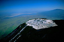 Aerial view of Ol Doinyo Lengai Crater (The Mountain of God) Rift Valley, Tanzania. Note- small cones on crater floor formed by previous eruptions of lava, still active.