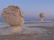 The White Desert, near Bahariya, Egypt, with unusual round rock formations caused by wind eroding  the calcium rich rock.