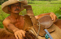 Vaquero Simon Cedeño, San Ramón, nr Balsar coastal plain, Ecuador. Saddles in this region are hand made from a single piece of wood.  2005