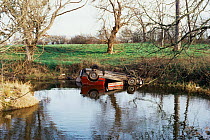 Car dumped in pond, Warndon, Worcestershire, UK.