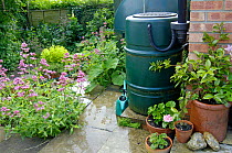 Garden water-butt with rain saving device, UK.