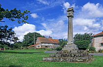 Great Walsingham village green with monument, north Norfolk, UK.