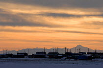 Village of Kaktovik at sunset, along Arctic coast of Alaska.