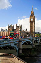 Houses of Parliament and Big Ben, Westminster, London, UK. Double decker bus crossing bridge