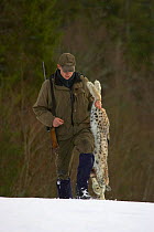 Norwegian hunter with recently shot Lynx as part of government quota system, Nord-Trondelag, Norway