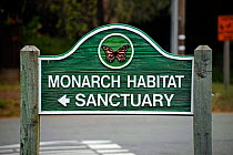 Sign for Monarch butterfly roosting sanctuary during migration, California, USA.