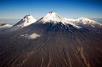 Kluchevskoy Volcano,  the highest volcano in Eurasia, flanked by volcanos Plosky (flat) Tolbachik and Ostry (sharp) Tolbachik. Kluchevskoy Nature Reserve, Central Kamchatka. .