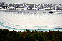 Dalney (Far) Lake covered with ice, Uzon Caldera, Kronotsky Zapovednik Reserve, Russia.