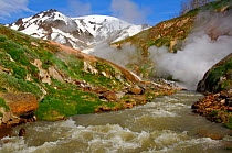 Horizontal Geyser feeding hot water into Geyser River, Valley of the Geysers, Kronotsky Zapovednik Reserve, Kamchatka, Russia.
