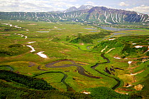 Aerial view of Shumnaya River flowing out of lake, Caldera of the Uzon Volcano, Kronotsky Zapovednik Reserve, Russia.