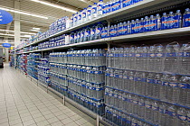 Bottles of drinking Mineral Water for sale in supermarket, France. 2005. Digital Image Modified