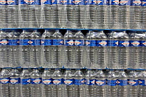 Plastic Bottles of drinking Mineral Water for sale in Supermarket, France.~2005. Digital Image Modified