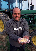Eli Galili, warden, with Maize peanuts for attracting and feeding Common cranes, Lake Agmon, Hula valley, Israel