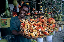 Native Jamaican selling Ackee / Akee {Blighia sapida} (National Fruit) at Street Market, Hope Bay, Jamaica.