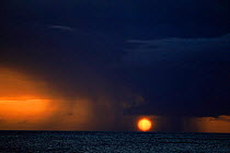 Sun shining through heavy rain squall, Grand Turk, Turks and Caicos Is, Caribbean