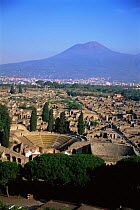 Roman amphitheatre and ruined city of Pompeii with Mount Vesuvius in the background, Southern Italy.