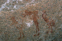Rock art / cave paintings, people hunting, Namibia.