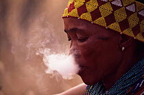 Jo / Hoan bushman smoking, Bushmanland, Namibia. 1996