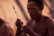 Jo / Hoan bushman with traditional arrow, Bushmanland, Namibia. 1996