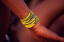 Bracelet on wrist of Jo / Hoan bushman, Bushmanland, Namibia.