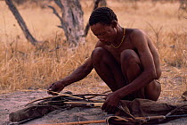 Jo / Hoan bushman with traditional bow and arrows, Bushmanland, Namibia. 1996