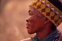 Jo / Hoan bushman with traditional beaded headdress, Bushmanland, Namibia. 1996