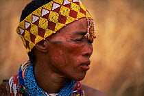 Jo / Hoan bushman with traditional beaded headdress, Bushmanland, Namibia. 1996