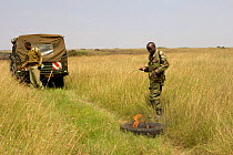Park rangers set fire to the plains by dragging burning tyre behind truck, Maasai Mara Reserve, Kenya