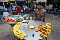 Typical street scene, with food trader, Old Town, Delhi, India