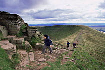 Hikers walking to Pen y Pan, Brecon Beacons NP, Powys, Wales, UK
