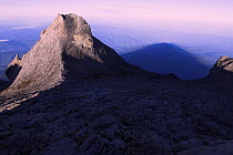 Shadow of summit cast behind St John's Peak (4090m) Mt Kinabalu, Sabah, Borneo, Malaysia.