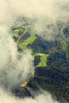 View of Mt Kinabalu Golf Club viewed through clouds from the summit, Mt Kinabalu, Sabah, Borneo, Malaysia.